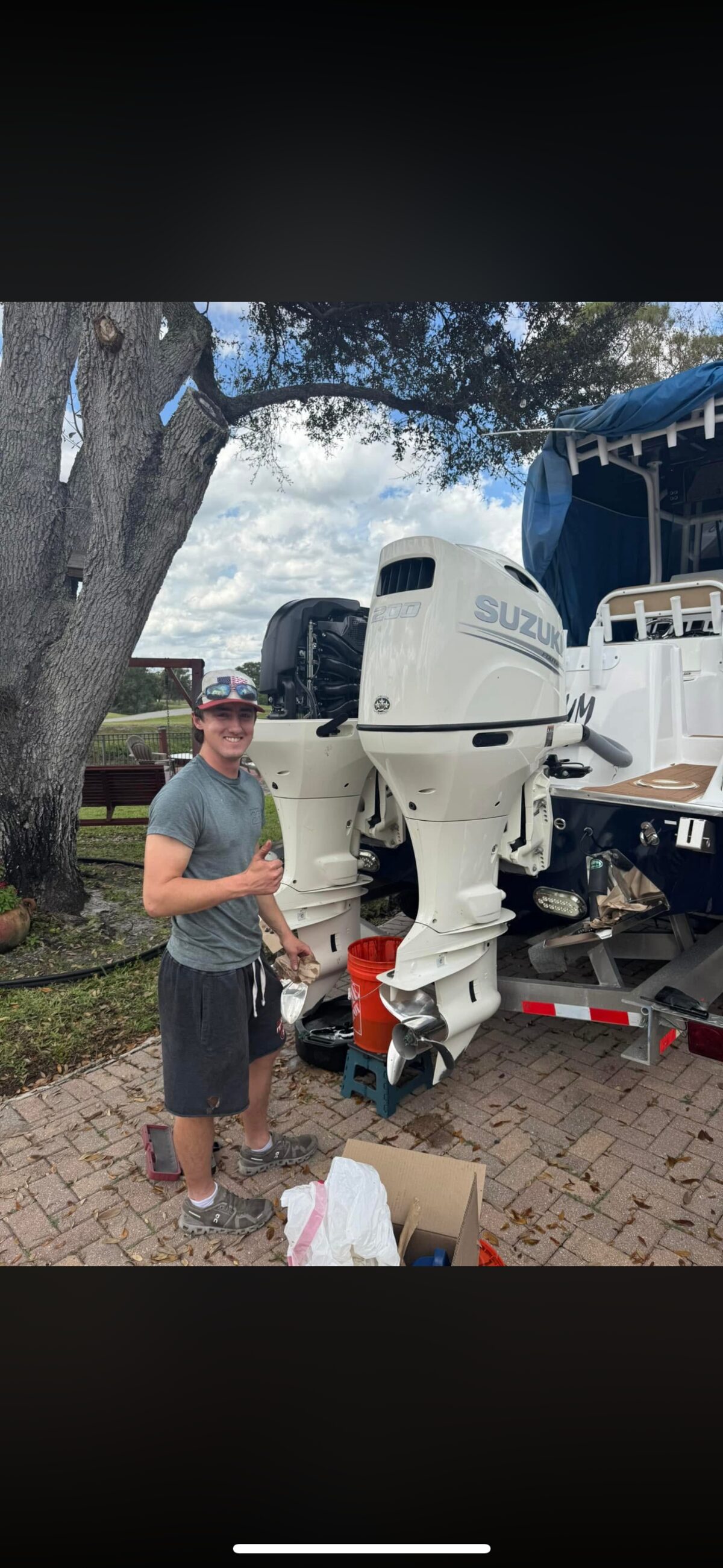 Logan completing twin Suzuki 200 outboard service