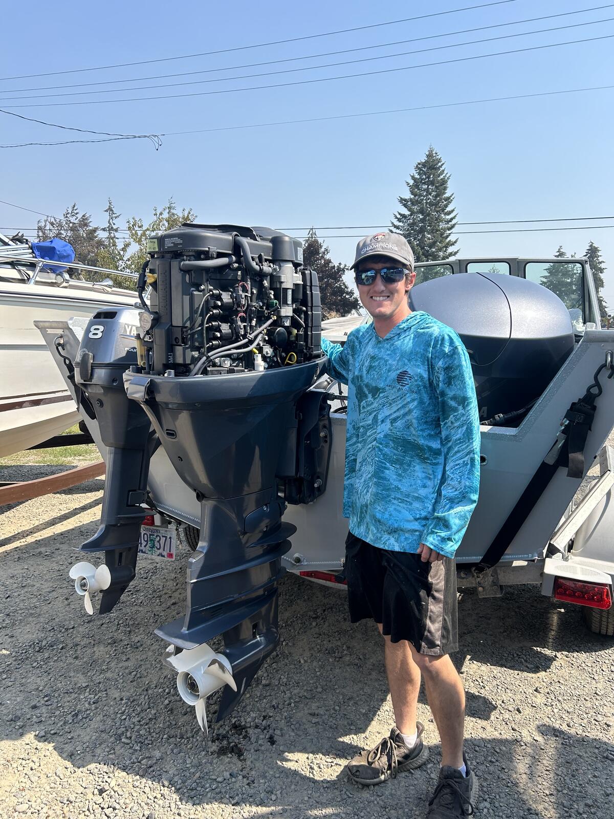 Logan, Marine Medic founder, performing Yamaha outboard service